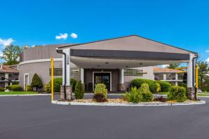 a front view of a building with a parking lot at Best Western Bordentown Inn in Bordentown