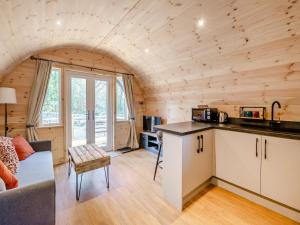 a kitchen and living room in a log cabin at Farm View - Uk43708 in Cloughton