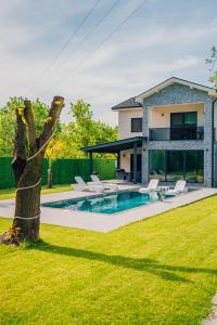 a house with a swimming pool in a yard at VİLLOVE Sapanca in Sapanca