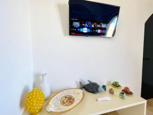 TV a/nebo společenská místnost v ubytování Magaggiari Reef