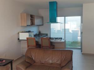 A kitchen or kitchenette at Canteli residencial con alberca