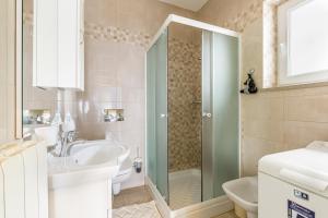 a bathroom with a sink and a shower at Apartments with a parking space Brsec, Opatija - 7796 in Martina