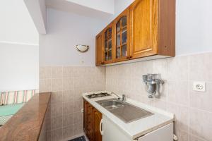 a small kitchen with a sink and a counter at Studio Brsec 7796a in Martina