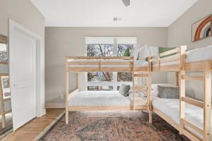 a bedroom with two bunk beds and a window at Serene Boho Chic Home-Mins to DT in Nashville