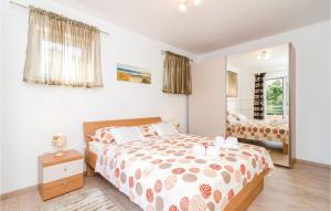 Posteľ alebo postele v izbe v ubytovaní Two-Bedroom Apartment In Cibaca