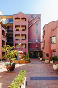 an empty courtyard of an apartment building with plants at Spectacular views over Albert Park in Melbourne