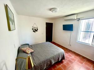 a bedroom with a bed and a window at beautiful apartment with the best location in Puerto Vallarta