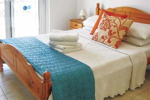 מיטה או מיטות בחדר ב-Royal St.Georges