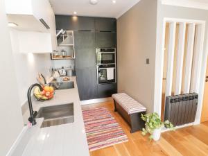 a kitchen with a sink and a counter top at The Crows Nest in Falmouth