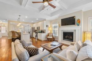 a living room with a couch and a fireplace at Fullerwood Delight- Mins to Beach and Downtown in St. Augustine