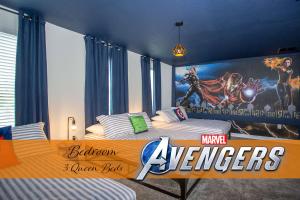a bedroom with two beds with a superhero mural on the wall at StarWars Game Room 9Bd5BA Sleep 25 ChampionsGate in Kissimmee
