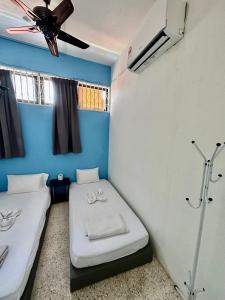 Postel nebo postele na pokoji v ubytování Mac Inn 94