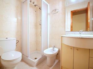 a bathroom with a toilet and a shower and a sink at Casa Palau Sabardera, 3 dormitorios, 6 personas - ES-228-139 in Palau-Saverdera
