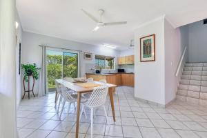 a kitchen and dining room with a table and chairs at OFFLINE - Charming 3BR Retreat in Central Location of Darwin in Stuart Park