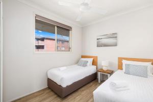 En eller flere senge i et værelse på Martys Little Beach No 14 + 13 billeder