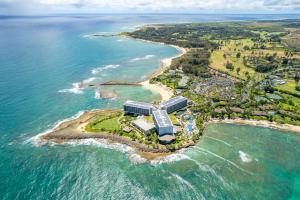 an aerial view of a building on a island in the ocean at Bamboo Hale - Golf Course View - Sleeps 2 in Kahuku