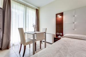 Hotel-Residence-b&b Le Dune beach service included客房内的一张或多张床位