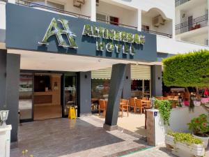 a hotel with a sign that reads akhtar hotel at Altinersan Hotel in Didim