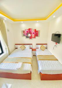 Postel nebo postele na pokoji v ubytování Phuc Con Son Hotel
