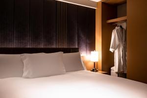 מיטה או מיטות בחדר ב-The Strings by InterContinental, Tokyo by IHG