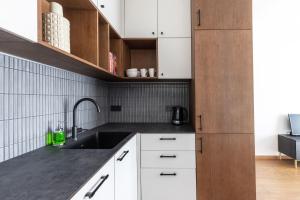 Kuchyň nebo kuchyňský kout v ubytování Cosy Home Paupys