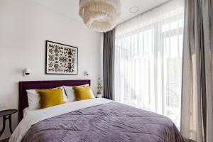 Postel nebo postele na pokoji v ubytování Cosy Home Paupys