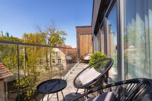Balkón nebo terasa v ubytování Cosy Home Paupys