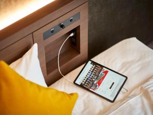 Postel nebo postele na pokoji v ubytování Daiwa Roynet Hotel Nagoya Shinkansenguchi