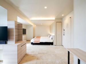 Postel nebo postele na pokoji v ubytování Daiwa Roynet Hotel Nagoya Shinkansenguchi