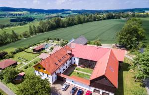 an aerial view of a house with a red roof at Birkholmhof in Bärnau