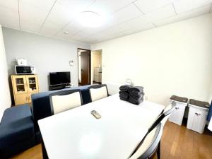 a conference room with a white table and chairs at Avidasion - Vacation STAY 13343 in Biei