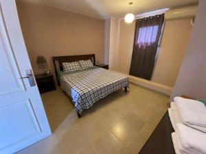 a bedroom with a bed and a window at View Villa Apartments Hurghada in Hurghada