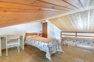 En eller flere senge i et værelse på Il Quadrifoglio 5