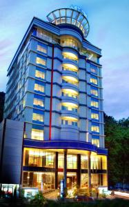 a tall blue building with a dome on top of it at ASTON Jayapura Hotel and Convention Center in Jayapura