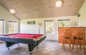 a pool table in a room with a ping pong ball at Stunning Home In Spttrup With 8 Bedrooms, Sauna And Indoor Swimming Pool in Vadum