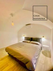 a bedroom with a large bed in a room at Casa Nannina - Seaview Terrace with Jacuzzi in Capri in Capri