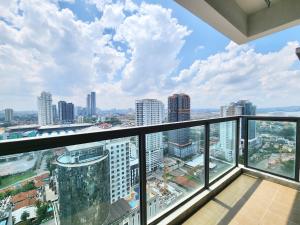a view of the city from the balcony of a building at R&F Princess Cove CIQ Premium Sea View Suites by NEO in Johor Bahru