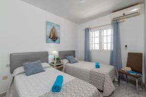 A bed or beds in a room at Villa Volcan by Villa Plus