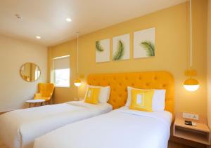 Katil atau katil-katil dalam bilik di Bloom Hotel Koramangala
