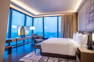 Postel nebo postele na pokoji v ubytování JW Marriott Hotel Xi'an