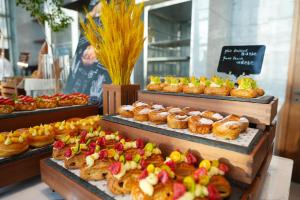 a bakery with many different types of pastries on display at JW Marriott Hotel Xi'an in Xi'an