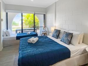 Katil atau katil-katil dalam bilik di Beachside Palms Unit 4 +8 gambar
