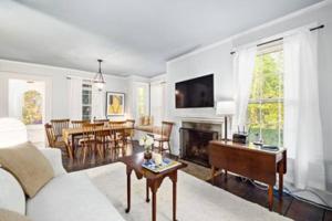 a living room with a couch and a table at Tophet Road, 3-BR with Spa Plunge Pool - PoshPadsCT in Roxbury