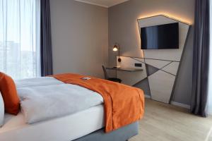 Rúm í herbergi á Holiday Inn - the niu, Hub Dusseldorf Messe by IHG