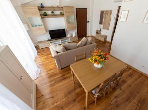 Телевизор и/или развлекательный центр в Alloggio Turistico Flavia