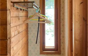 a hanger in a room with a window at Cozy Home In Ljuster With Kitchen in Norra Ljustero