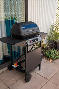 a grill on top of a table with a bbq at Macleay Island Getaway in Macleay Island