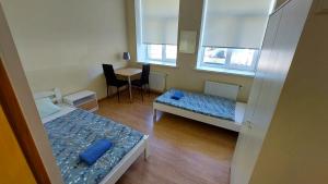Postel nebo postele na pokoji v ubytování Happy Hotel