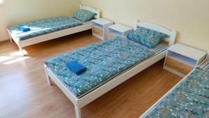 Postel nebo postele na pokoji v ubytování Happy Hotel