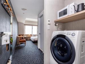 Letto o letti in una camera di Tokyu Stay Kanazawa